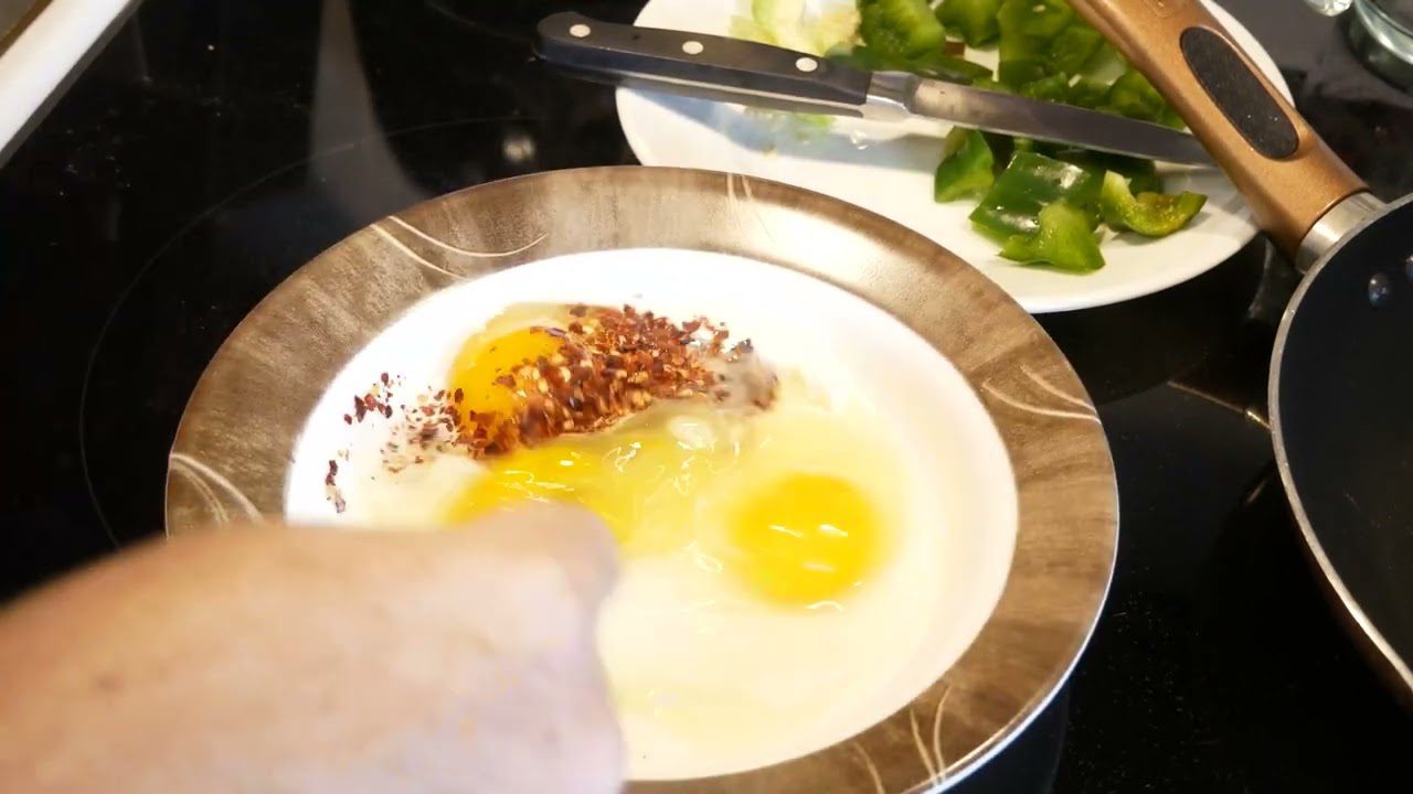 Preparing for making an egg omelette or egg omelet.